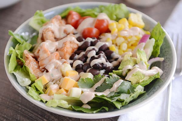 A BBQ chicken veggie and rice salad bowl. 