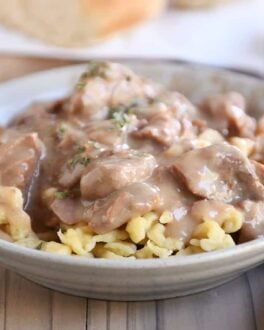 Bowl of slow cooker beef stroganoff over spaetzle.