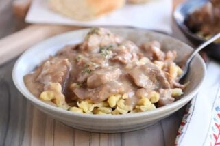 Bowl of slow cooker beef stroganoff over spaetzle.