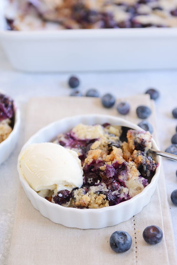 This tried-and-true, easy recipe for blueberry dump cake is made with a simple cake mix, fresh or frozen blueberries, butter, and milk. Minimal mixing!