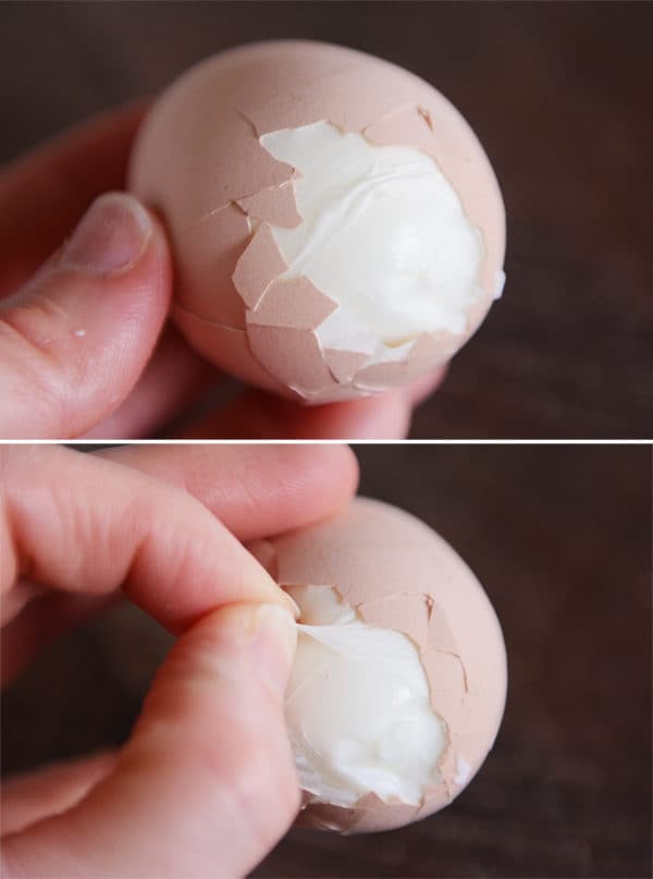 Two pictures of a hand holding an egg partially peeled. 