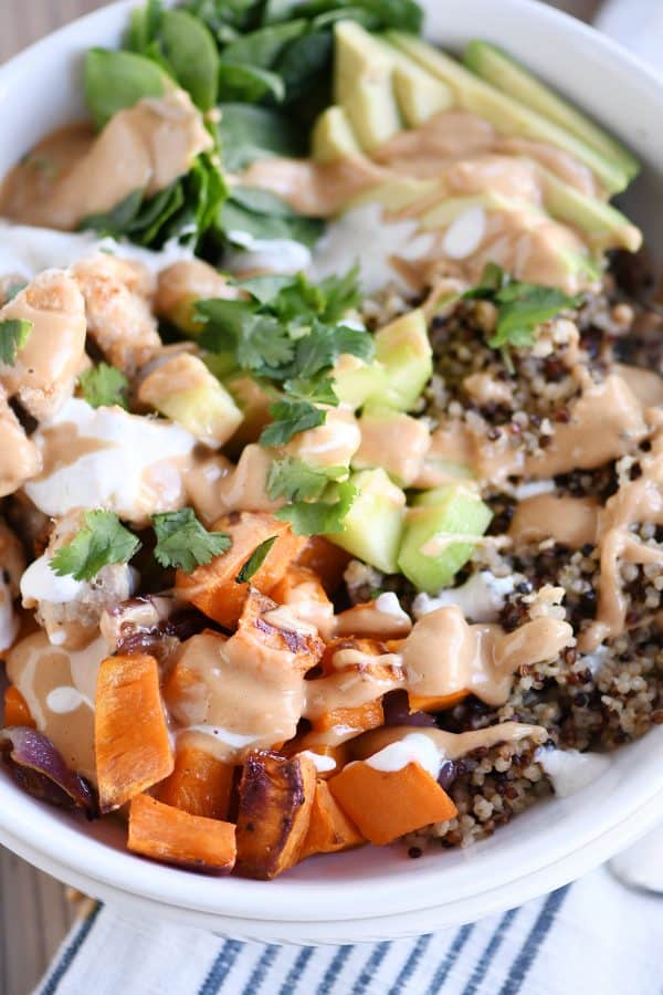 Top down view of Buddha bowl recipe with peanut sauce.