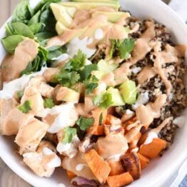 Landscape view Top down view of Buddha bowl recipe with peanut sauce.