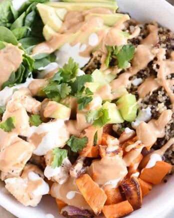 Landscape view Top down view of Buddha bowl recipe with peanut sauce.