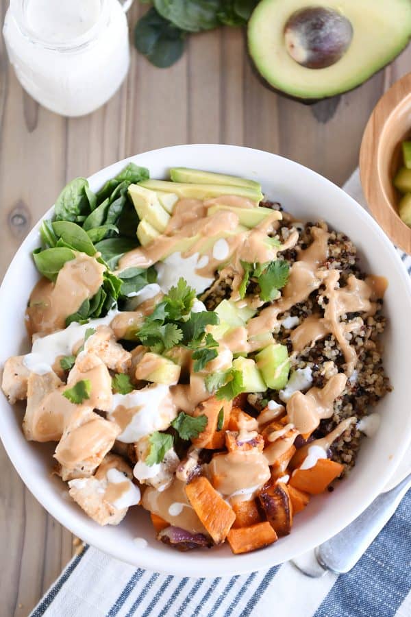 Top down view of Buddha bowl recipe with peanut sauce.