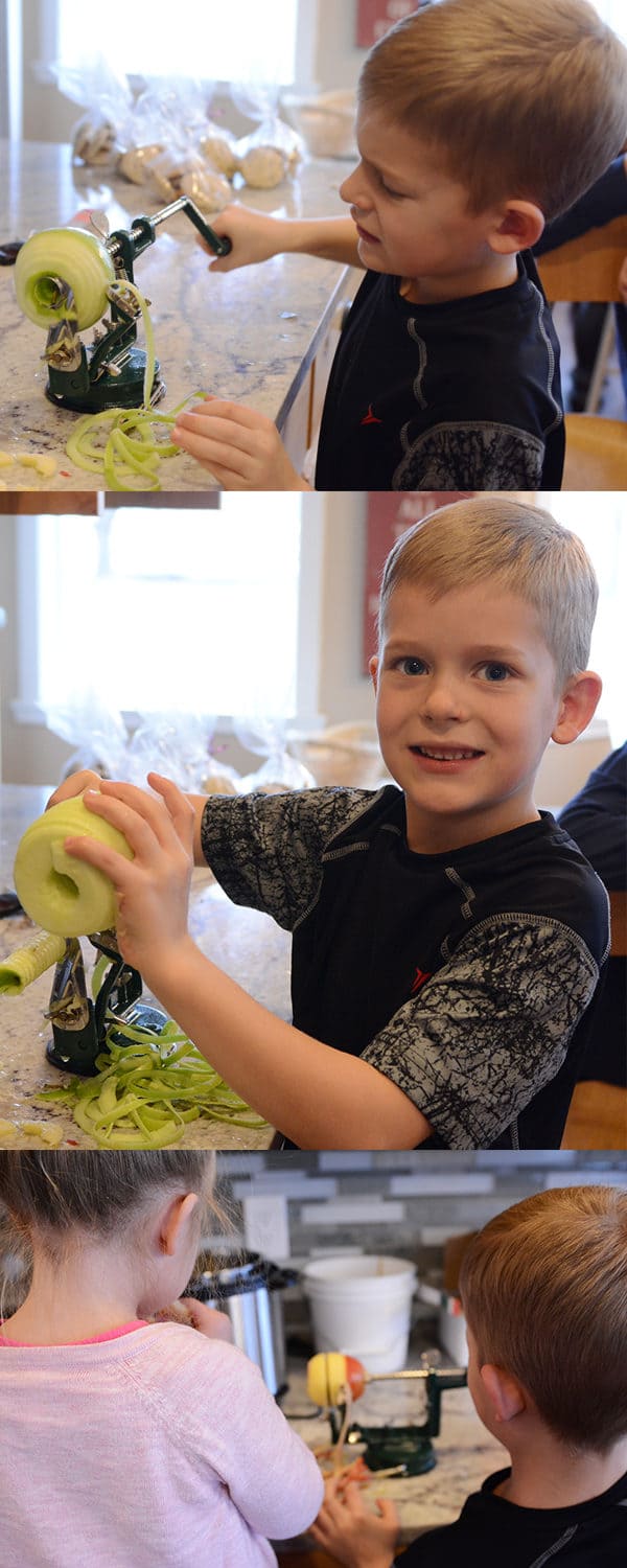 Little kids spiraling up apples.