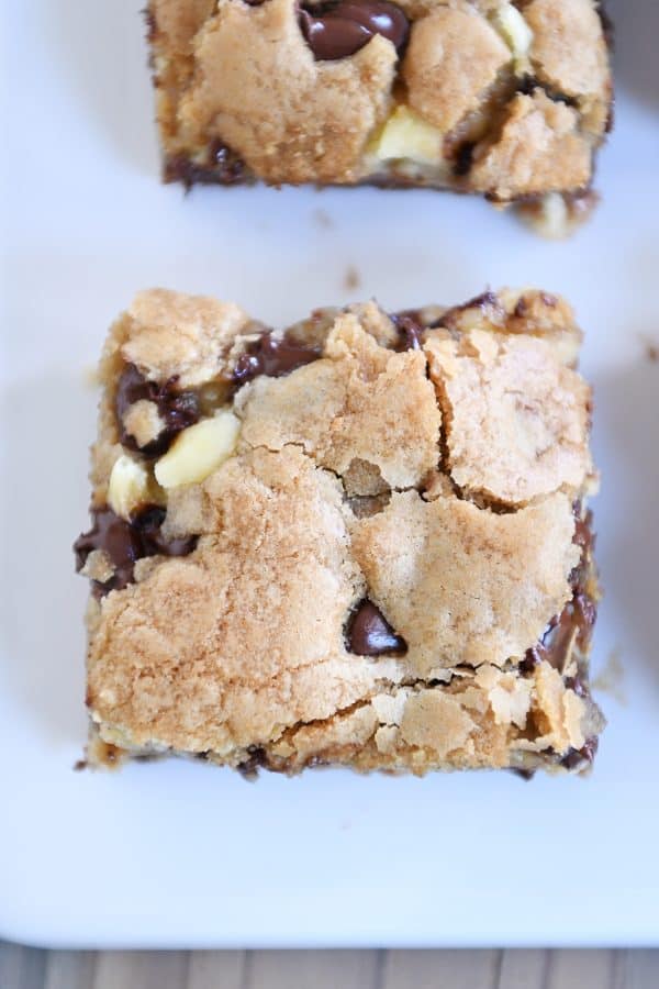 Top down view of crackly top of caramel cheesecake stuffed chocolate chip cookie bar.