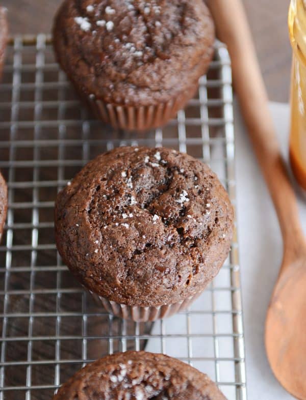 Top down view of double chocolate salted caramel muffin on cooling rack