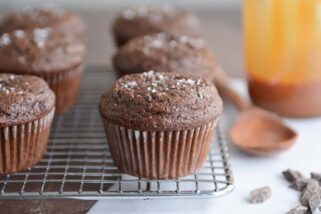 Double chocolate salted caramel muffin on cooling rack