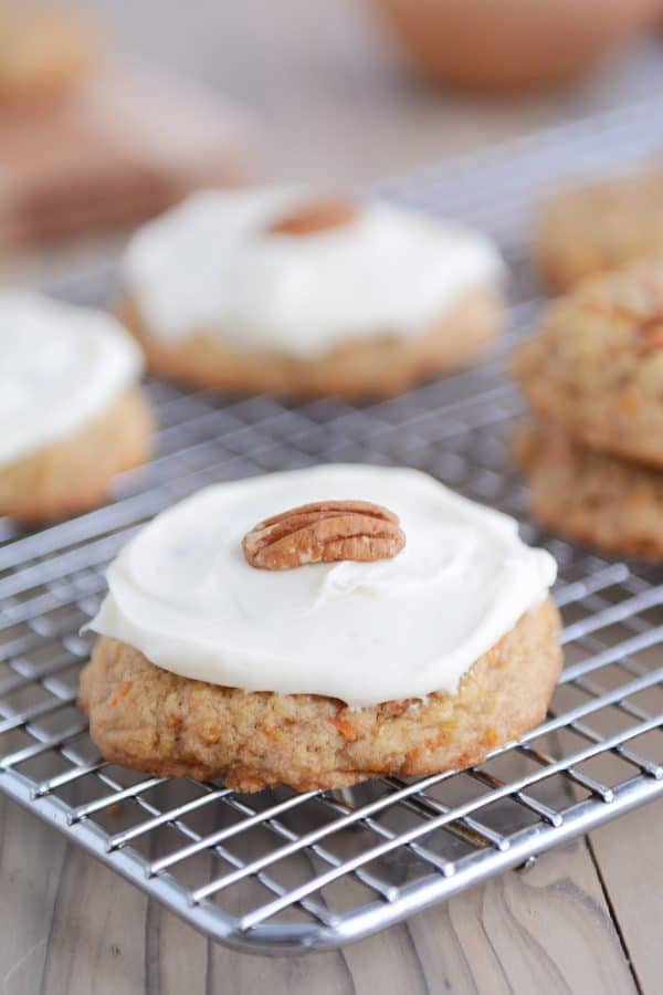 Frosted carrot cake cookie on cooling rack.