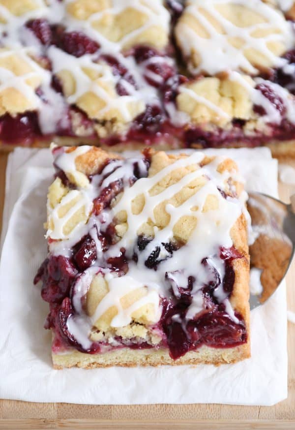 Cherry pie cookie bar on white napkin.