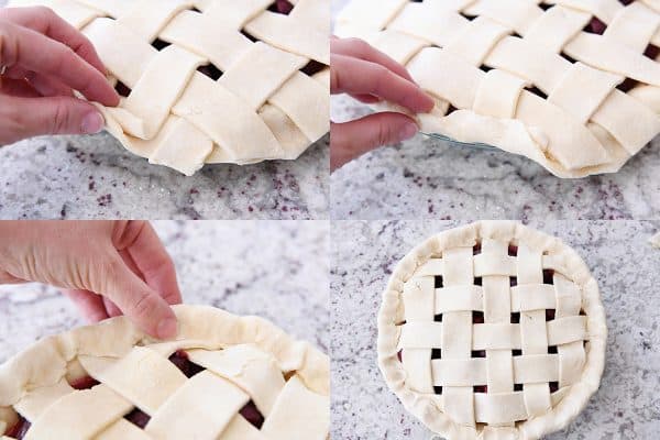 Folding over bottom edge of cherry pie crust to seal edges.