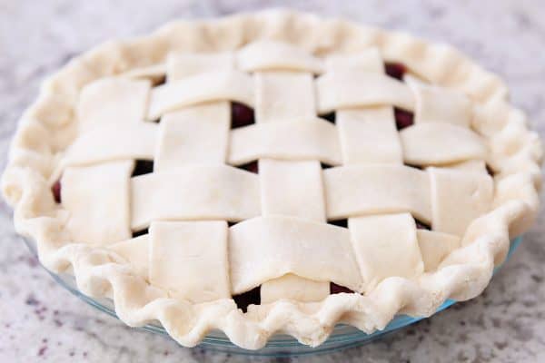 Fluted edge of cherry pie crust.