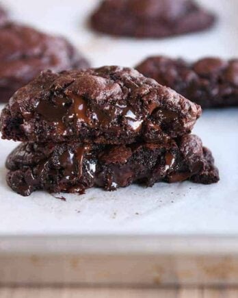 Double dark chocolate cookie broken and stacked on top of each other.