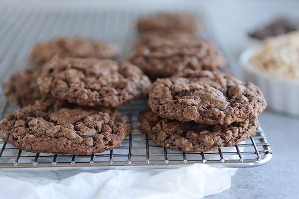 Chocolate cookies on a cooling rack.