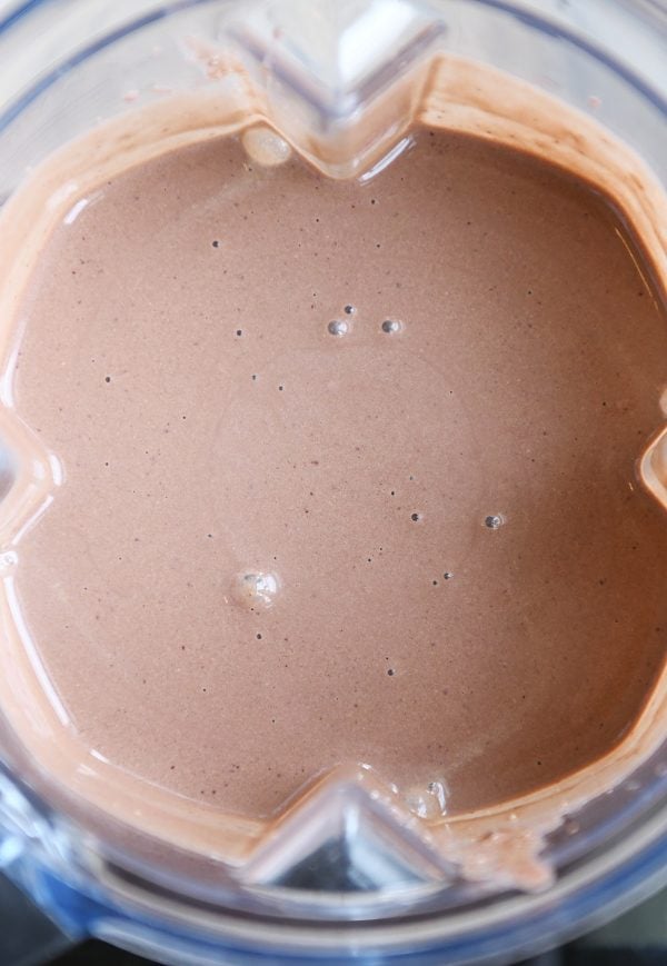 Top down view of chocolate protein smoothie.