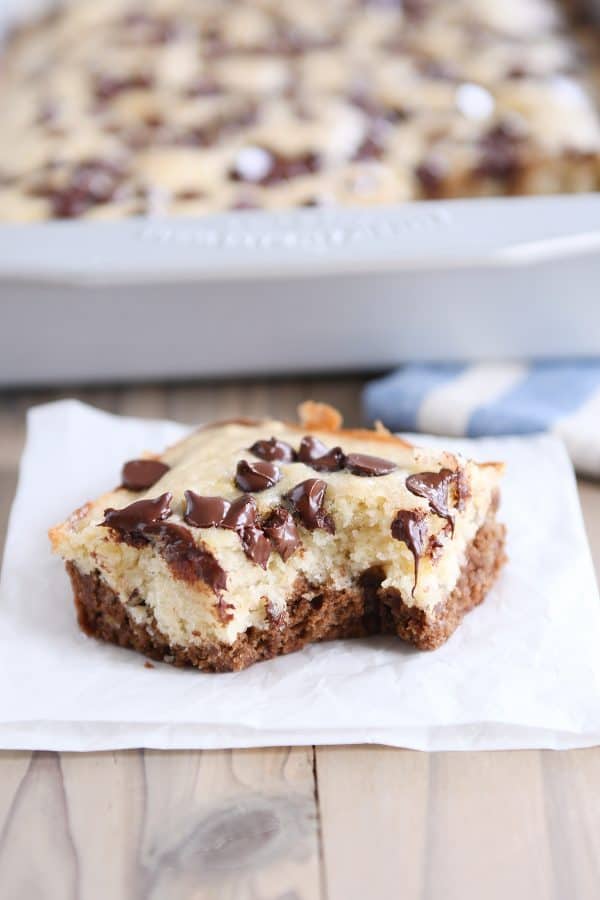 Square of choco-banana bars on white napkin.