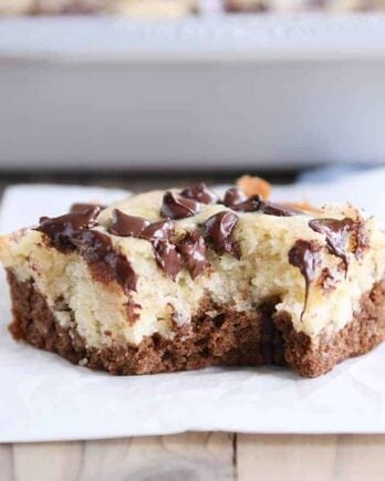 Square of choco-banana bars on white napkin.