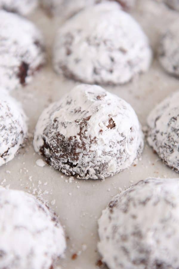 Tray of powdered sugar coated chocolate truffle cookies.
