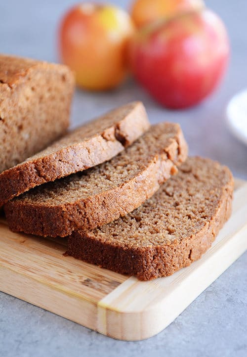 The thick slices of whole grain applesauce bread cut off of the rest of the loaf.