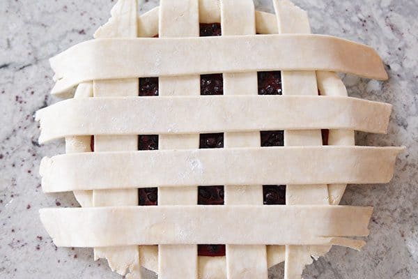 Top view of a berry pie with lattice crust.