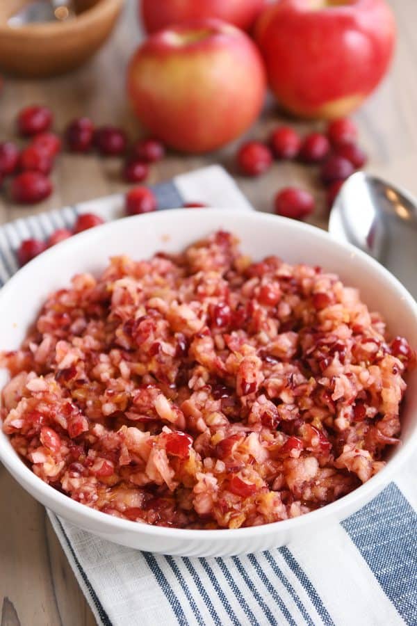 Fresh cranberry apple relish in white serving bowl.