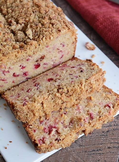 Two thick slices of white chocolate cranberry bread cut of the loaf.