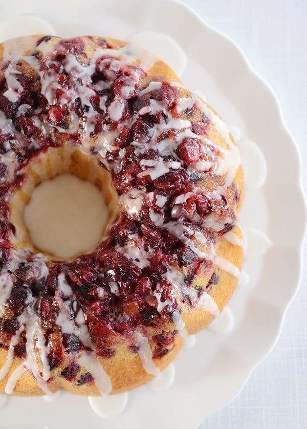 Top view of a cranberry topped glazed lemon bundt cake.