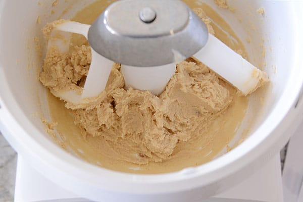 Butter and sugar mixing inside of a Bosch bowl.