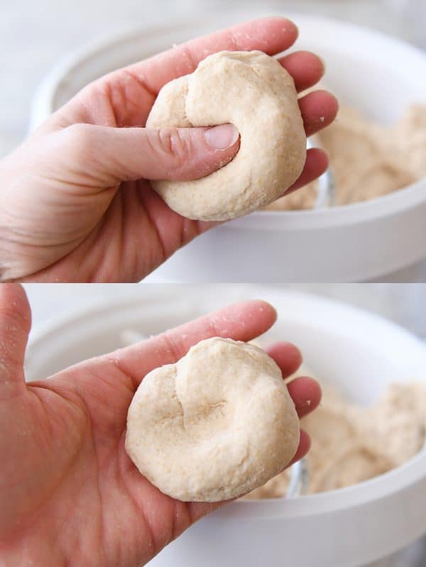 Pressing dimple in piece of bread dough.