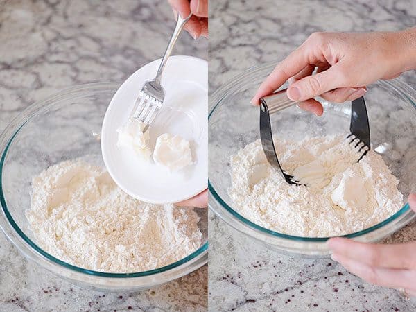 Two pictures of butter getting put into a glass bowl of flour and then getting blended in with a pastry blender.