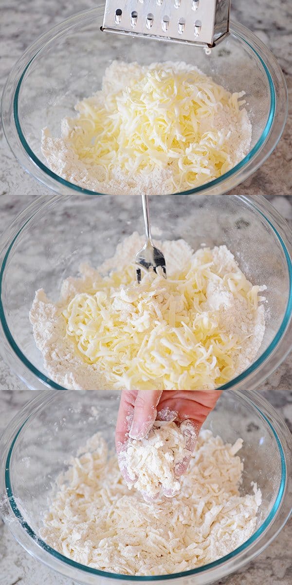 Butter getting grated into a glass bowl.