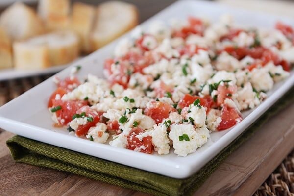 White tray full of a Greek feta tomato dip. 