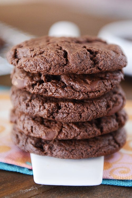 A stack of five soft chocolate cookies.