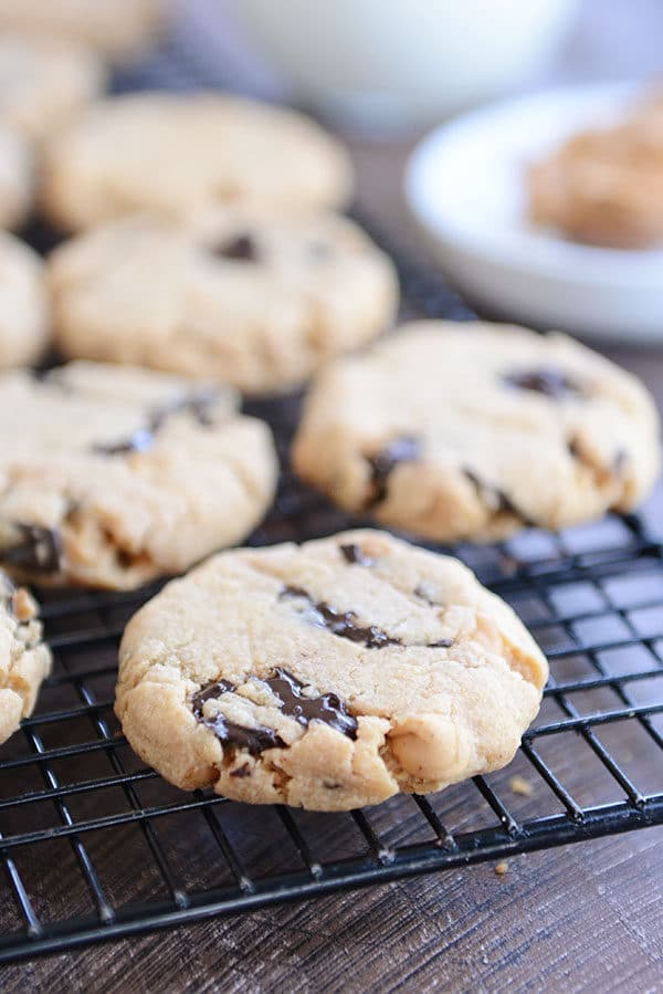 Peanut butter chocolate chip cookies on a metal cooling rack. 