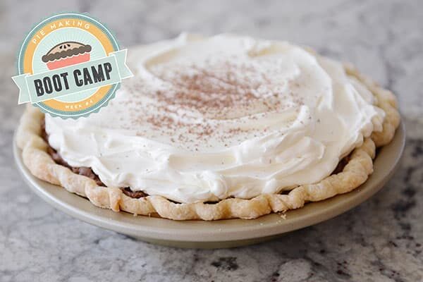 A whipped cream and cocoa dusted chocolate pie.