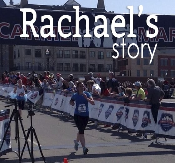 A woman crossing the finish line of a race.