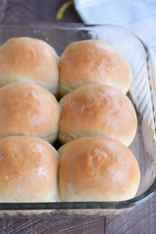 Six, baked french bread rolls in a glass 9X13-inch pan. 