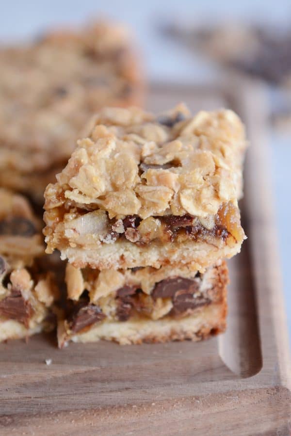 Caramel oat chocolate chunk shortbread bar stacked on another bar.