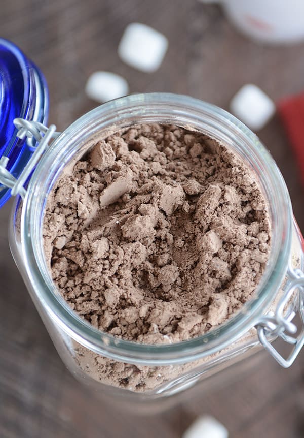 Glass jar filled with homemade hot chocolate powder.