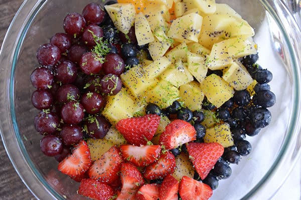 Top view of a fruit salad in a glass bowl.