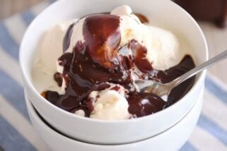 Vanilla ice cream in white bowl with 5-minute hot fudge sauce on top.