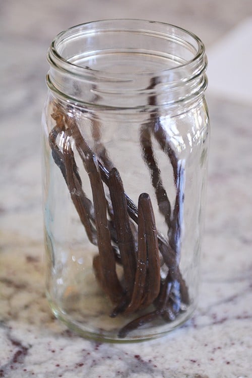 A mason jar full of vanilla beans.