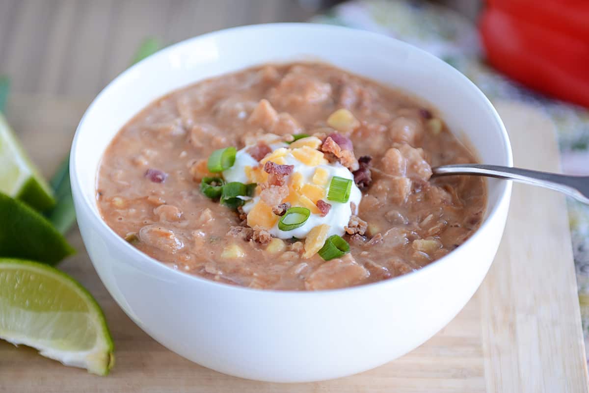 Slow cooker jalapeño popper white bean chili with cream cheese and bacon