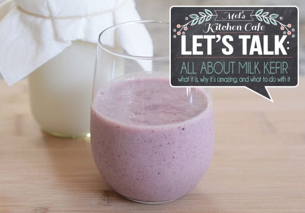 A glass of berry kefir milk with text in the corner of the picture that says let's talk about milk kefir.