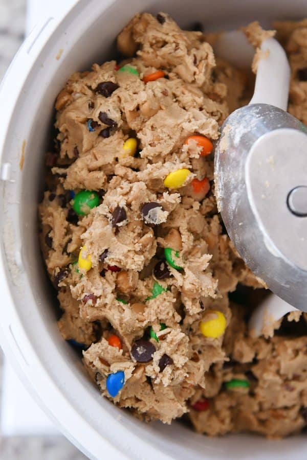 Mixed peanut butter kitchen sink cookie dough in Bosch mixer.