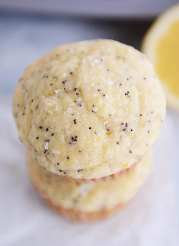 Two lemon poppy seed muffins stacked on each other.