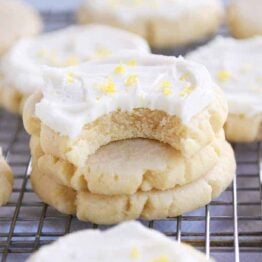 Bite taken out of frosted lemon swig sugar cookies.