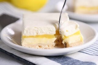 Lemon truffle shortbread bar on white plate.