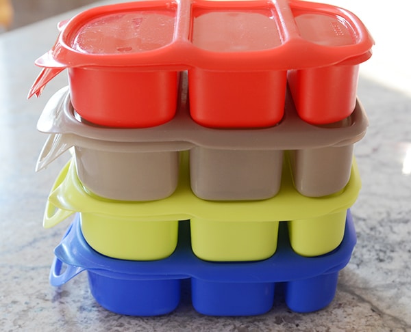 Four bento lunchboxes stacked on top of each other.